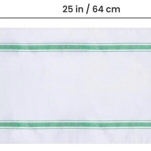 Size diagram of the white bread tea towel with green stripes, measuring 25 inches / 64 cm wide by 15 inches / 38 cm tall.