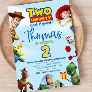May include: A blue and yellow birthday invitation featuring characters from the Toy Story movie franchise. The invitation says "Two Infinity and Beyond! Thomas is turning 2."  It includes details for a birthday party, including the date, time, address, and RSVP information.