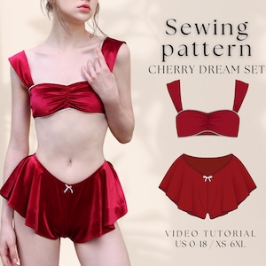 Puede incluir: Un conjunto de lencería de terciopelo rojo con top y shorts a juego. El top tiene un escote cuadrado y los shorts tienen un dobladillo con volantes. Se muestra el texto "Sewing pattern CHERRY DREAM SET". La talla es US 0-18 / XS-6XL.