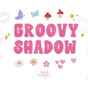 May include: Pink text that reads "GROOVY SHADOW" with a white outline, surrounded by embroidered butterflies, mushrooms, flowers, hearts, and stars on a white background. The text is in a retro font.