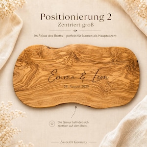 Pode incluir: Uma t&aacute;bua de servir de madeira com borda natural, gravada com os nomes "Emma & Leon" e a data "28. August 2025". A t&aacute;bua tem uma cor castanha clara e um padr&atilde;o de gr&atilde;o de madeira &uacute;nico. O texto "Positionierung 2" est&aacute; no topo.