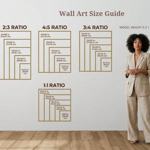 May include: Wall Art Size Guide graphic with size ratios and dimensions in inches and centimeters. A woman in a beige suit stands next to the guide. The guide shows 2:3, 4:5, 3:4, and 1:1 ratios with measurements like 24x36 in (61x91 cm).