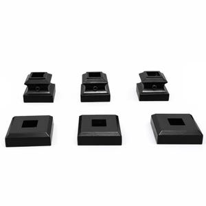 May include: A set of six black metal components consisting of three square base plates with central cutouts and three matching square post collars, each featuring a small side screw hole for secure attachment to a railing or post system.