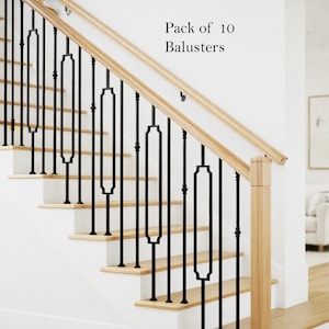 May include: A pack of 10 black metal balusters installed on a staircase with light wood treads and a matching wooden handrail. The balusters feature a central rectangular geometric design with rounded corners and thin vertical support rods.