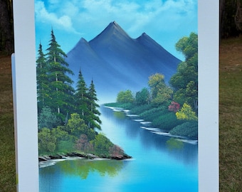 Pintura de rio e montanha no estilo Bob Ross, arte de paisagem serena.