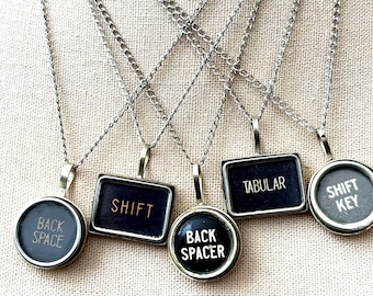 Back spacer, Tabular, shift, shift key and back space  and round tabular vintage typewriter key  charm pendant     16' chain artisan jewelry
