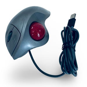 May include: A grey trackball mouse with a red ball and a USB cable. The mouse has an ergonomic design with buttons on the side and top. The black USB cable is coiled.