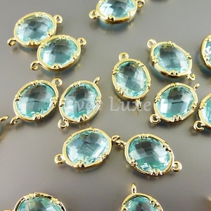 2 aqua blue oval shape faceted glass crystal charm with loops, oval glass pendants / connectors, crystals 5041G-AQ