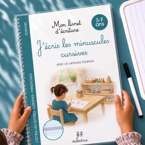 May include: A spiral-bound writing workbook titled Mon livret d'écriture J'écris les minuscules cursives with a teal spine. The cover features a 3-7 ans age label, a graphic of a child writing at a table, and a small circular sample of lined paper.