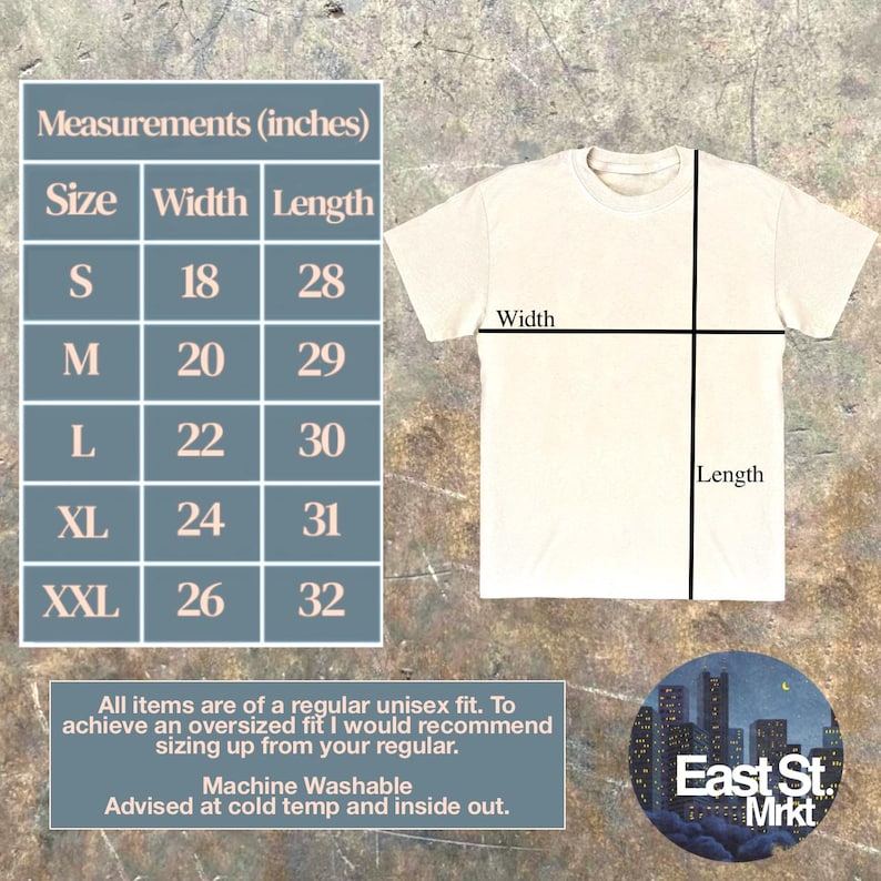 May include: Cream-coloured unisex t-shirt with measurements in inches. Sizes range from S (45.7cm width, 71.1cm length) to XXL (66cm width, 81.3cm length). The shirt is machine washable and advised to be washed cold and inside out. The East St. Mrkt logo is in the bottom right.