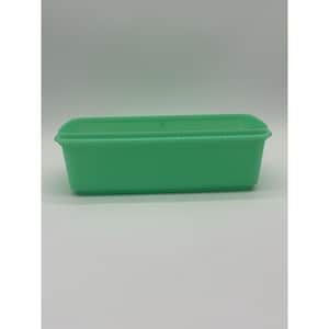 May include: A rectangular, light green plastic container with a lid. The container is empty and sits on a white surface. The container is a solid, opaque color and has a simple, functional design. The container is likely used for storage.