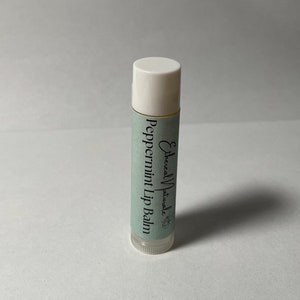 May include: A white tube of peppermint lip balm with a green label that says "Ethereal Naturale" and "Peppermint Lip Balm".