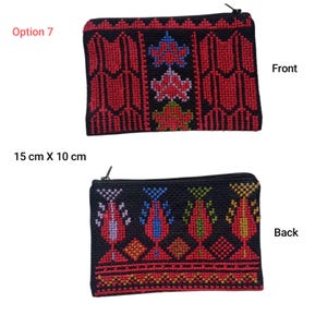 May include: Black and red embroidered pouch, 15 cm x 10 cm, with a zipper closure. The front features a red and black geometric design with floral accents. The back has a different embroidered pattern with colorful floral motifs.