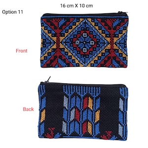 May include: A rectangular, zippered pouch with a detailed, geometric pattern. The front features a blue, red, and gold design, while the back is black with a blue, red, and gold pattern. The pouch measures 6.3 inches by 3.9 inches.