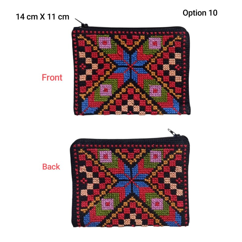 May include: A rectangular, black zippered pouch with a colorful cross-stitch design. The front and back of the pouch feature a geometric pattern in red, blue, green, and gold. The pouch measures 14 cm x 11 cm.