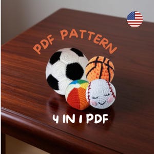 May include: Four crocheted sports balls are displayed: a football, basketball, beach ball, and baseball. The football is white with black patches. The basketball is orange with black lines. The beach ball is multicoloured. The baseball has stitched details.