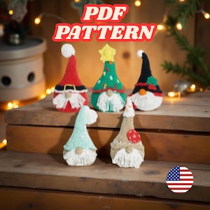 May include: Five handmade crochet gnome ornaments in various colours, including red, green, and tan. Each gnome has a white beard and a unique hat design, some with festive embellishments. The image includes the text "PDF PATTERN".