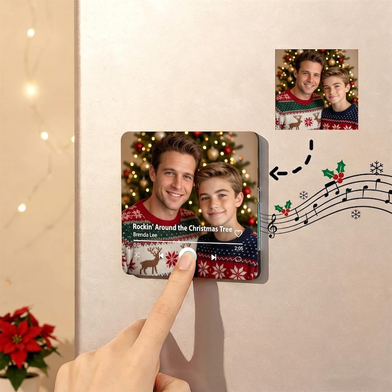 May include: A square acrylic plaque featuring a photo of two people wearing matching red and white patterned holiday sweaters in front of a Christmas tree. The plaque displays a music player interface with the text Rockin' Around the Christmas Tree.