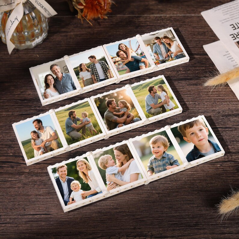 May include: Several white photo tiles arranged on a dark wood surface. Each tile displays a different family photo. The photos show couples, parents with children, and individual children. The tiles are rectangular and have a decorative edge.
