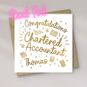 May include: A white greeting card with gold foil text that reads "Congratulations Chartered Accountant Thomas." The card features illustrations of calculators, books, and charts. The words "Real Foil" are in pink neon letters above the card.