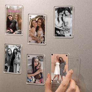 May include: Clear acrylic photo magnets with pictures of friends. Some magnets have text that says "MOM" and "BFF". One magnet has the text "Can't say I do without you". The magnets are on a gray surface.
