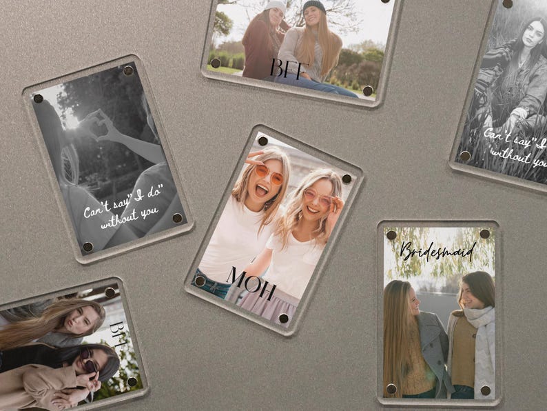 May include: Clear acrylic photo frames with images of people. Some frames have text that reads "Can't say I do without you", "BFF", "MOH", and "Bridesmaid". The photos are in color and black and white.
