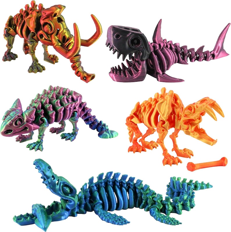 May include: A collection of colorful, 3D-printed dinosaur and animal skeleton models. The models include a rhino, shark, chameleon, and a creature with a bone. Each skeleton is painted with vibrant colors, including orange, purple, and blue.