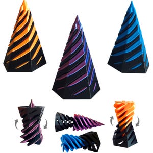 May include: A collection of geometric, abstract sculptures in various colors. The sculptures are cone-shaped with a black base and colorful, layered designs in orange, purple, and blue. Some sculptures are shown in a rotating view.