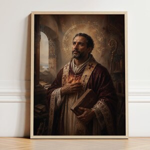 May include: A framed wall art print depicting a bearded man in religious vestments, including a deep red robe and a stole with cross motifs. The figure holds a book against their chest, with a golden halo behind their head in a stone interior.