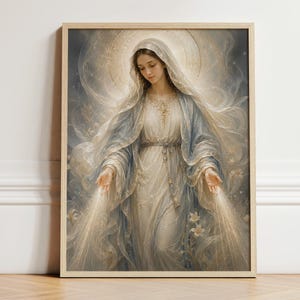 May include: A framed wall art print depicting a figure with a veil and flowing robes in shades of cream and soft blue. The figure has hands extended downward, emitting golden light rays, surrounded by ethereal swirling patterns and white lilies.