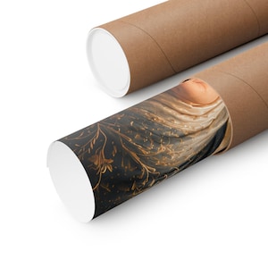 May include: A rolled poster print featuring a dark black background with intricate gold floral and vine patterns, transitioning into soft cream and beige fabric-like folds. The print is partially encased in a cylindrical brown cardboard tube.
