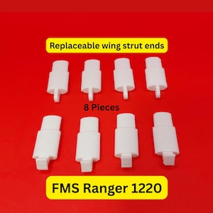 May include: A white ceramic mug with a black handle and the text "But First, Coffee" in a black, handwritten-style font. The mug is on a white surface.