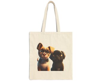 May include: Cream-colored tote bag featuring an illustration of two cartoon puppies. One puppy is tan and white with large eyes, and the other is black. The bag has a simple design with long handles, suitable for carrying items.
