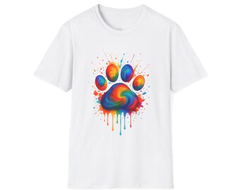 May include: White t-shirt with a colourful paw print design. The paw print is a vibrant mix of rainbow colours, with paint splatter effects. The design includes a swirling centre and dripping paint details, creating a lively and artistic look.