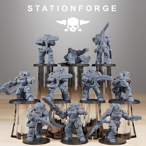 May include: A collection of gray miniature figurines of armored soldiers, each holding a weapon. The figurines are arranged on a tiered display, with the text "STATIONFORGE" and a skull logo at the top.