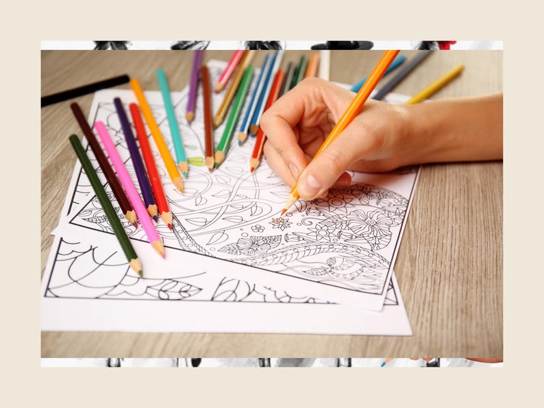 May include: A person's hand coloring a detailed black and white coloring book page with a set of colored pencils. The page features intricate floral designs.