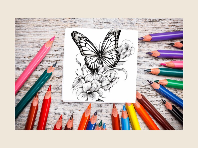 May include: A black and white line drawing of a butterfly with flowers on a white sheet of paper. The paper is surrounded by colored pencils on a wooden surface.