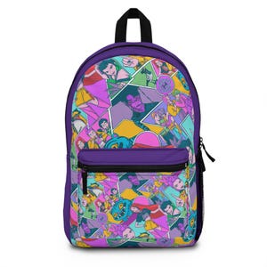 May include: Purple backpack with a colorful comic book-style design. The backpack features a front pocket, a top handle, and black zippers. The graphic includes various characters in vibrant colors like pink, yellow, and blue.