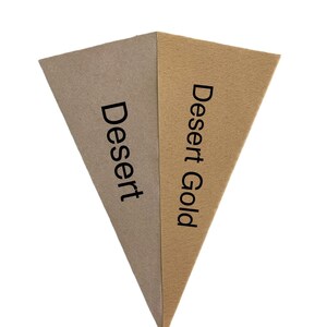 May include: Two triangular pieces of felt fabric, one brown and one beige, with the words "Dessert" and "Dessert Gold" printed on them.