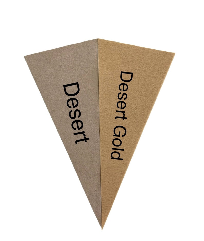 May include: Two triangular pieces of felt fabric, one brown and one beige, with the words "Dessert" and "Dessert Gold" printed on them.