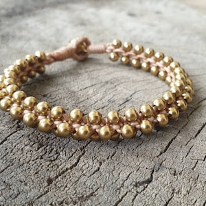 Pulsera de mujer tejida con cuentas de latón