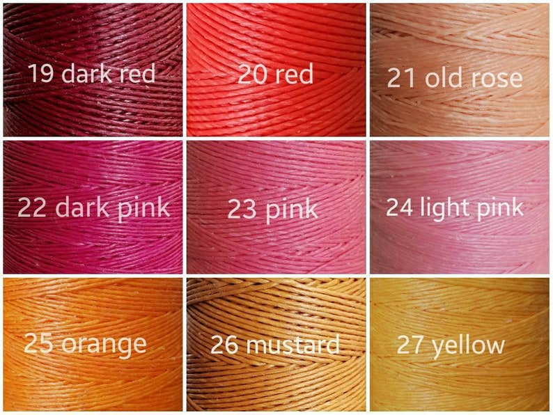 May include: Nine spools of waxed thread in various shades of red, pink, and orange. The spools are labeled with numbers and color names, including dark red, red, old rose, dark pink, pink, light pink, orange, mustard, and yellow.