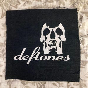 May include: A set of three ceramic mugs with a speckled, matte finish. The mugs are in shades of cream, light gray, and dark gray. Each mug has a simple, minimalist design, perfect for coffee or tea.