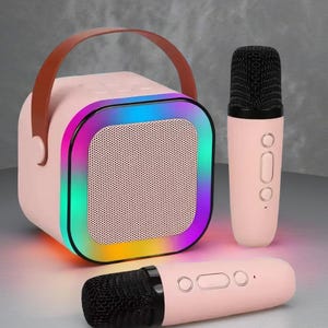 Mini máquina de karaoke portátil con 2 micrófonos inalámbricos, luces LED, efectos de cambio de voz, altavoz recargable, compacto y duradero