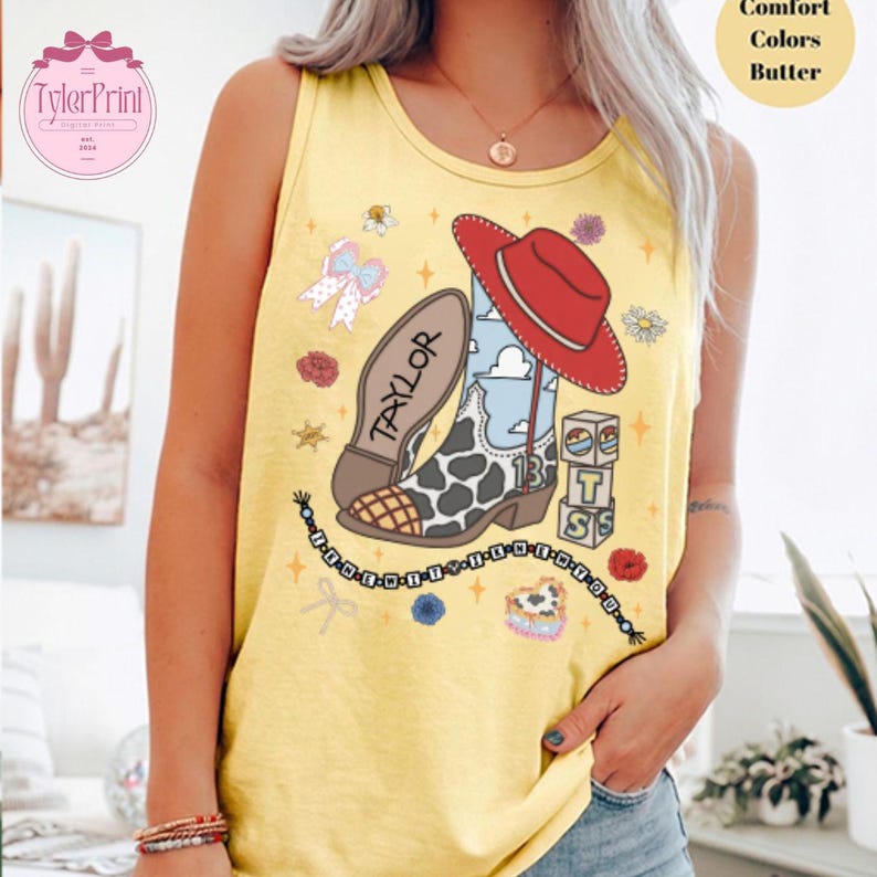 May include: A yellow tank top featuring a graphic print of a cowboy boot with a cow print pattern, a red cowboy hat, a stack of blocks with the letters T, S, and the number 13, a beaded bracelet with text, and various small floral and bow icons.