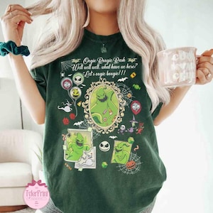 May include: Dark green t-shirt featuring a graphic of Oogie Boogie from The Nightmare Before Christmas. The design includes the text "Oogie Boogie Rash" and "Well well well, what have we here? Let's oogie boogie!!!" with other character illustrations.