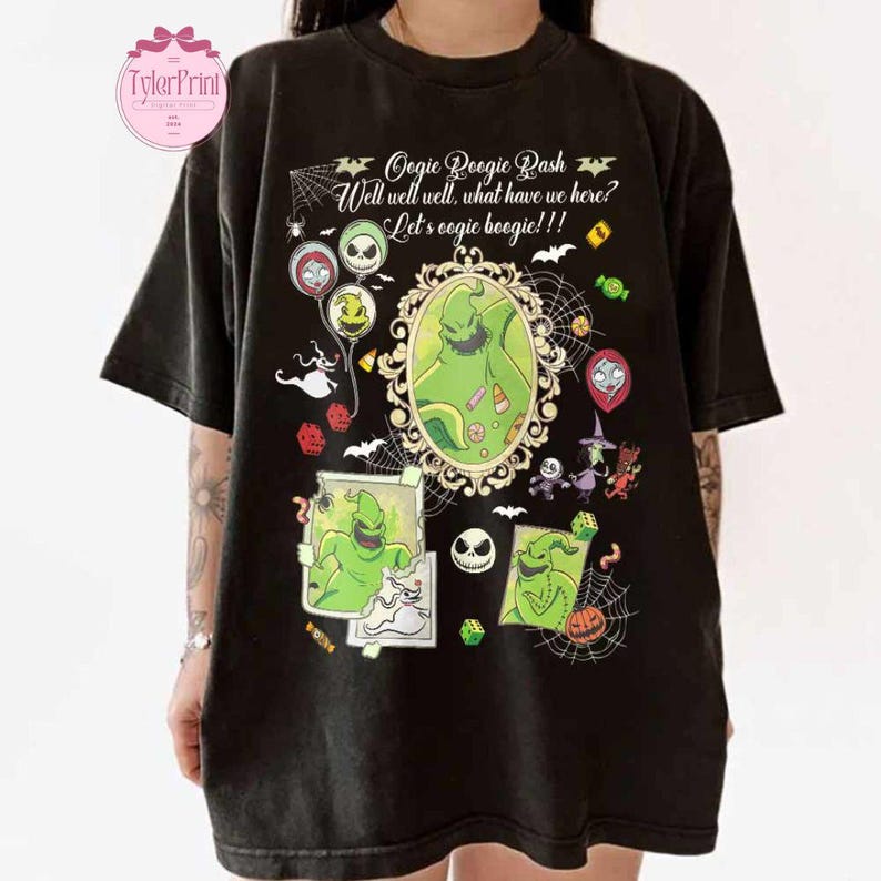 May include: Black t-shirt featuring a graphic design with the text "Oogie Boogie Bash" and the phrase "Well well well, what have we here? Let's oogie boogie!!" The design includes images of Oogie Boogie, Jack Skellington, and other characters.