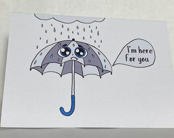 May include: A hand-drawn greeting card featuring a cartoon umbrella with a sad face under a rain cloud. The umbrella is gray and white with a blue handle. Text in a speech bubble reads, "I'm here for you."