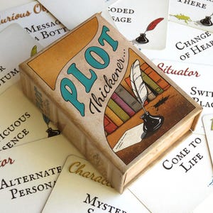 May include: A rectangular card game box titled Plot Thickener with an illustration of a quill pen in an inkwell and colorful books. The box is surrounded by white playing cards featuring text such as Inner Sanctum, Switch Places, and Come to Life.