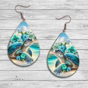 May include: Teardrop earrings with a sea turtle design. The earrings depict a teal turtle on a sandy beach with turquoise flowers and a blue sky. The earrings are approximately 5 cm in length.